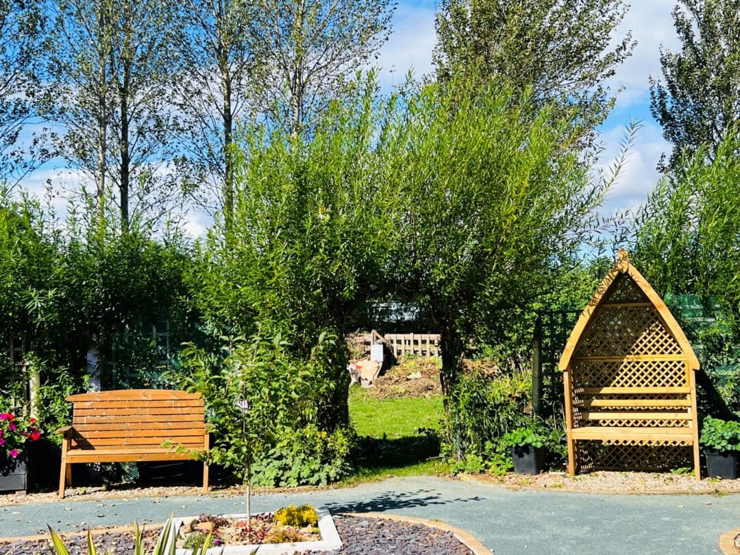 A Photo of the Community Garden Seating Area at Woodhouse Park