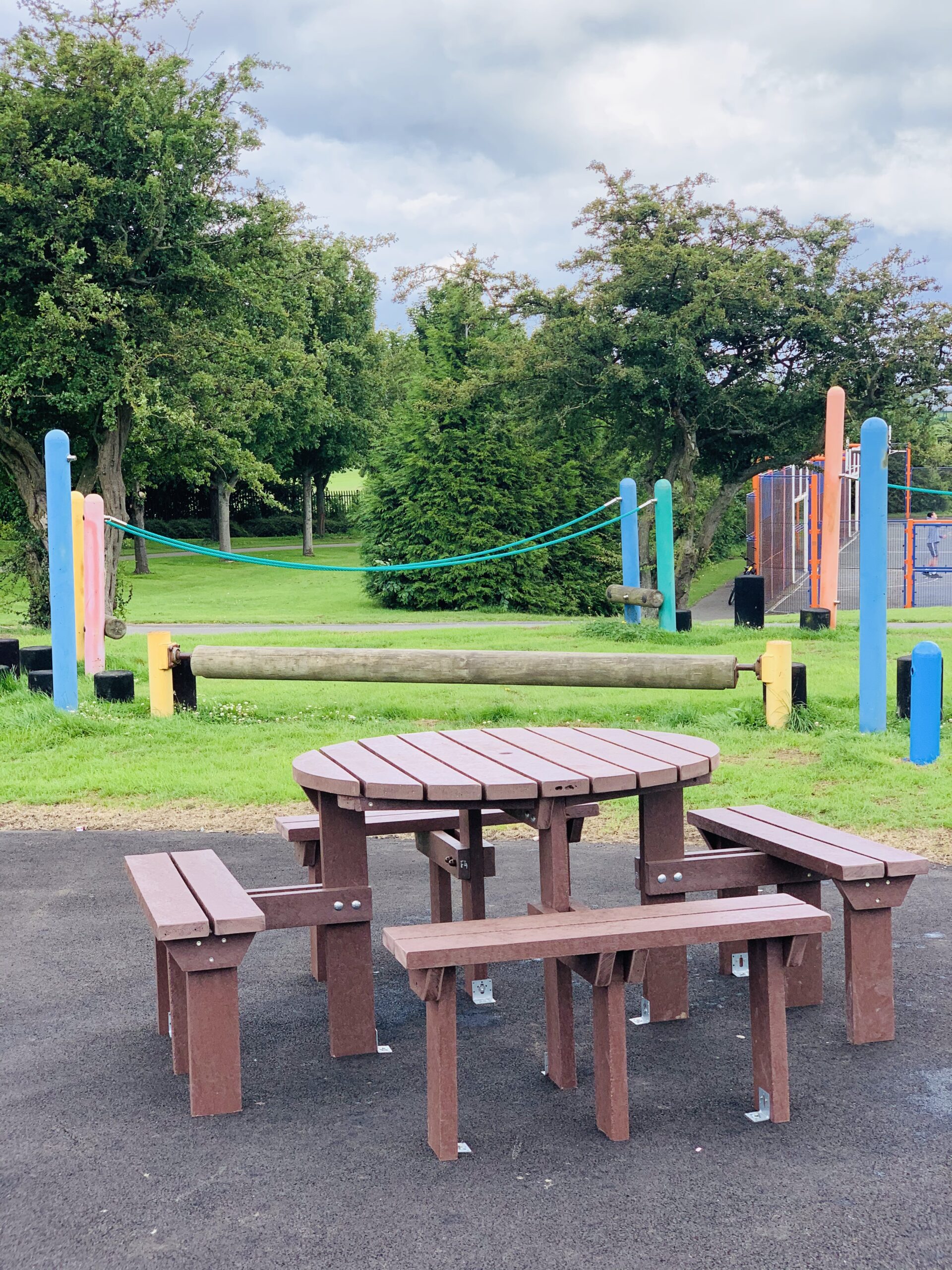 A Photo of Junior play equipment and a seating area at Woodhouse Park
